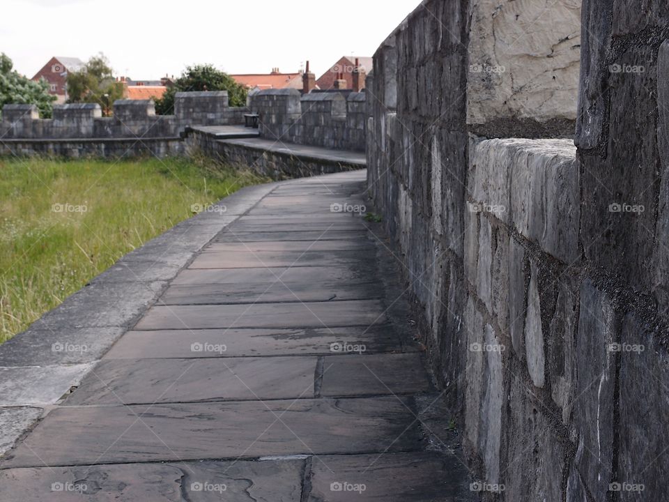 The historic fortified York Wall made of massive stone and a nice walkway surround the older parts of the city. 