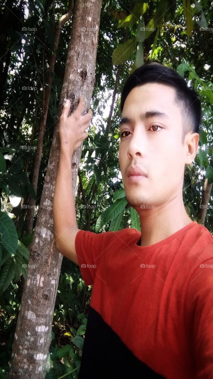 Stylish in front of a tree..ask for voice on my mission.