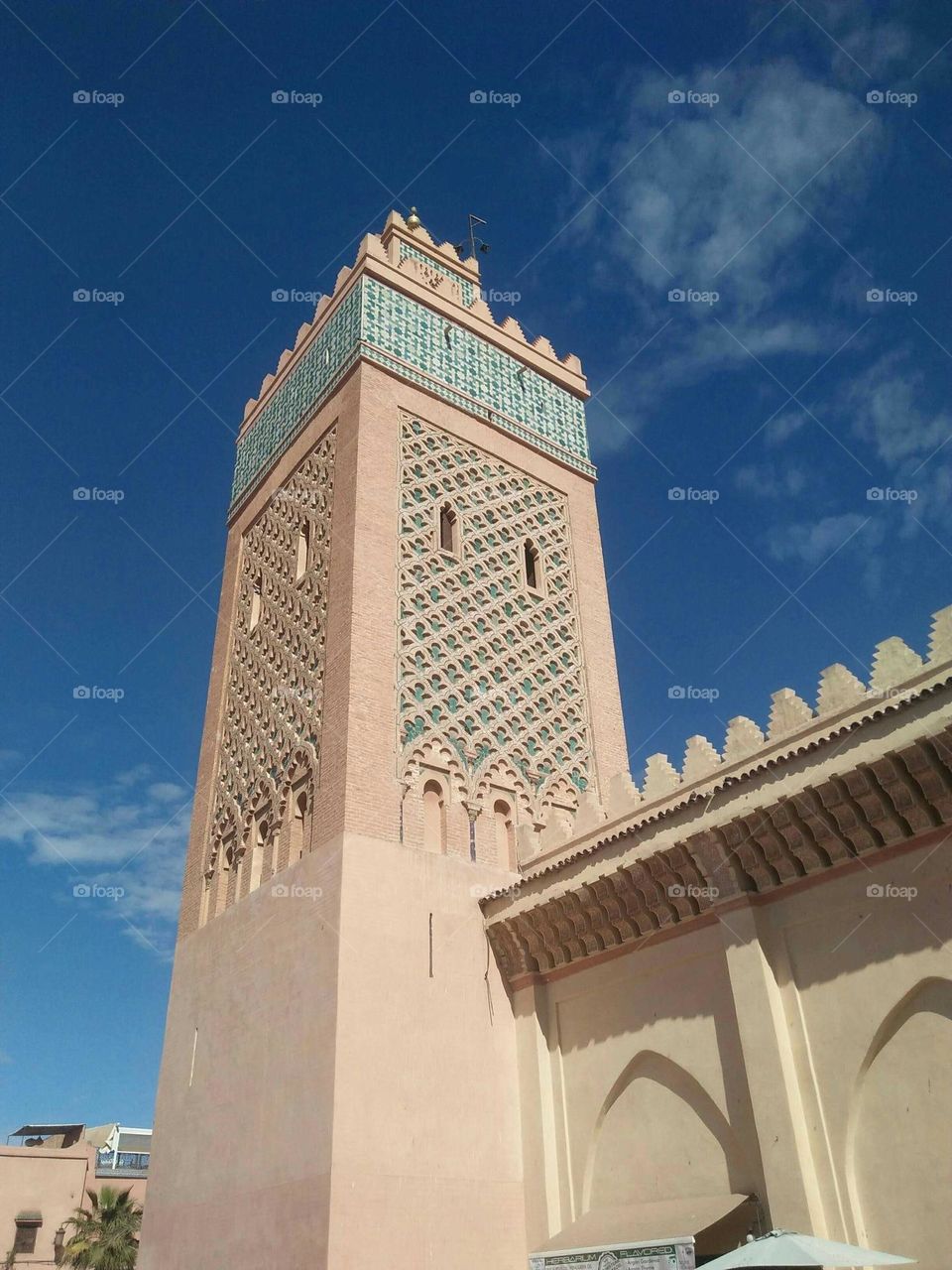 Beautiful and ancient minaret of kasbah mosque at marrakech city in Morocco.