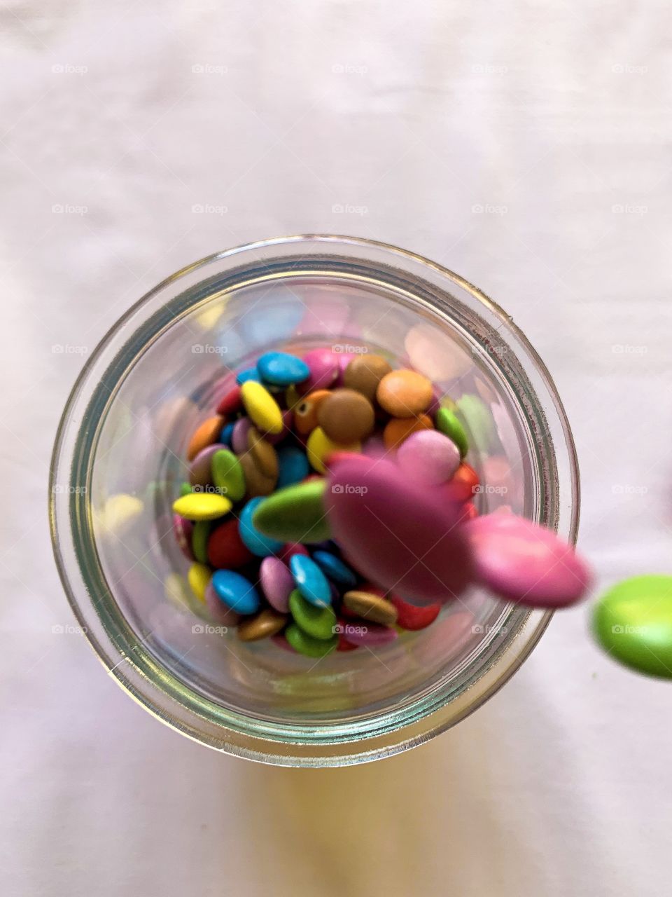 Clash of colours. Got to love the colourful smarties brighting up the container