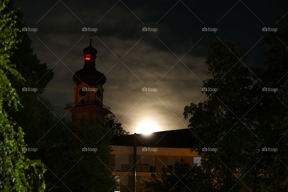 church steeple in the rising moon