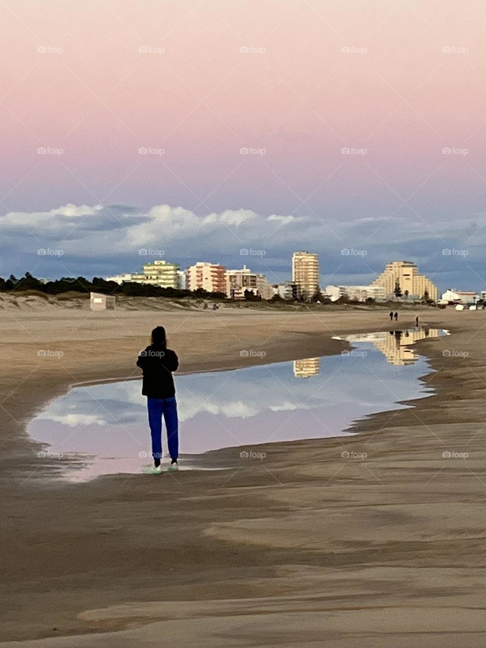 Lonely photographer on beach 