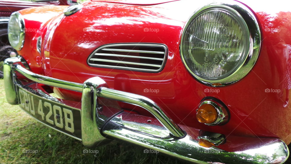 c reg  vintage car in red.