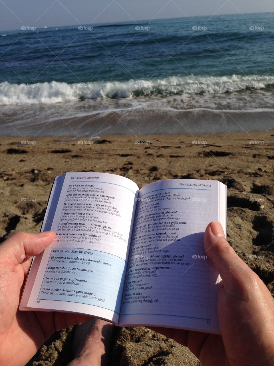 Learning Spanish phrases on Benalmadina beach
