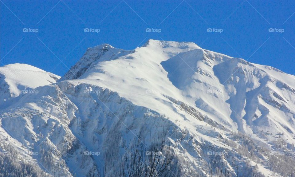 Snow covered mountains swiss alps