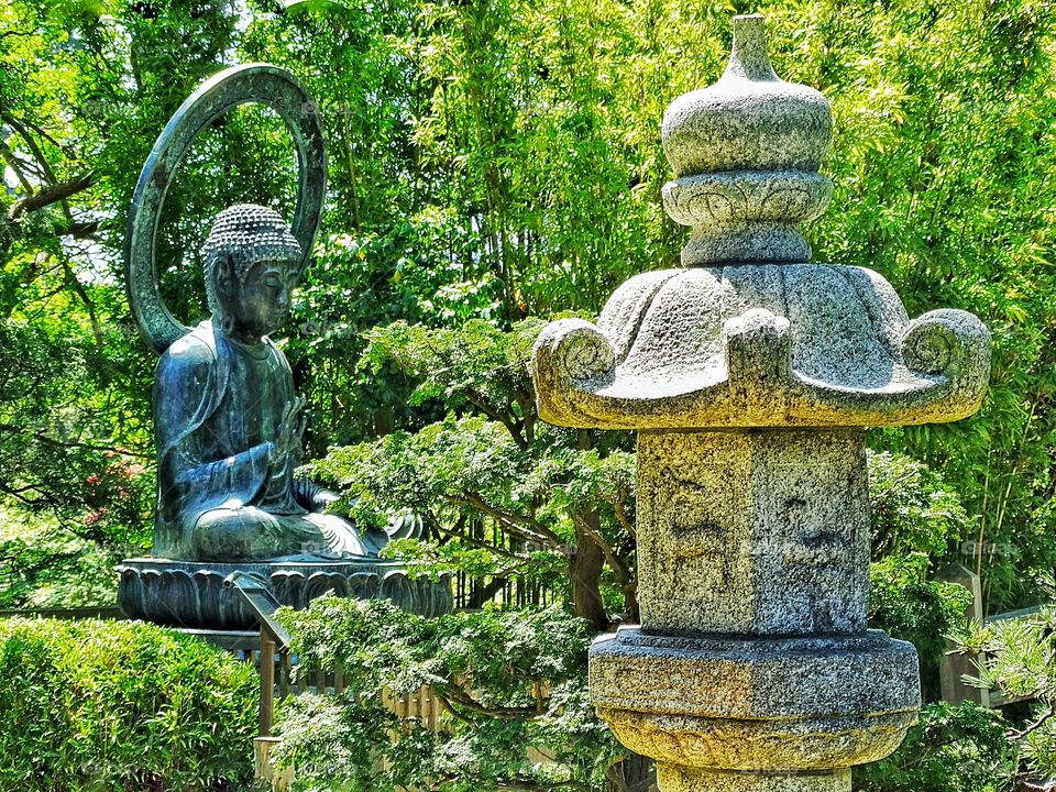 Japanese Buddhist Shrine. Serene Japanese Tea Garden Setting With Buddhist Statuary
