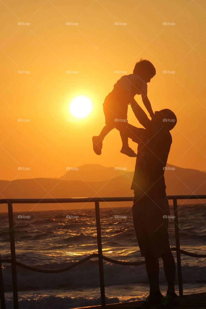 #dad and son #family #happy moments #play #sea #sunset #happiness