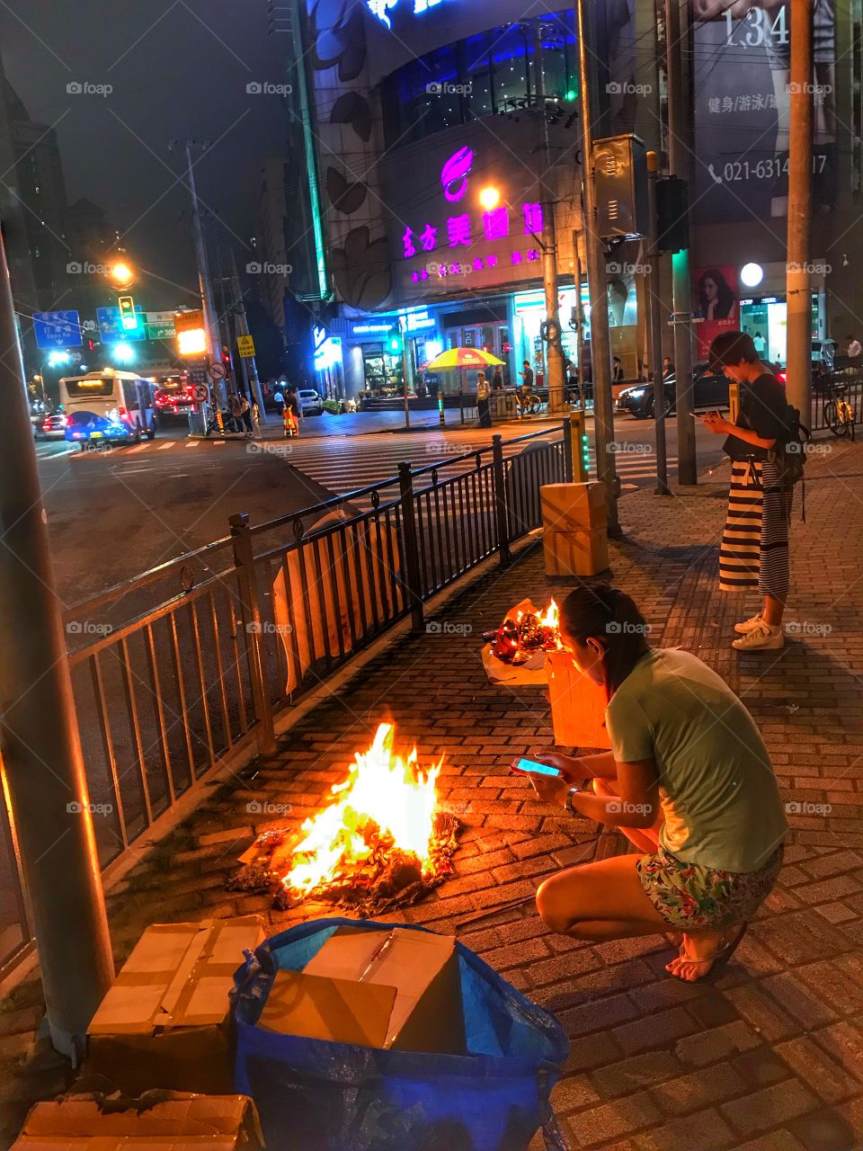 Burning fake money for luck in Puxi, Shanghai