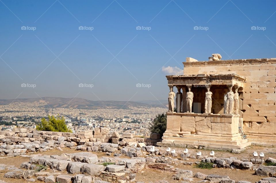 The Erechtheion and a view of Athens from atop the Acropolis, Greece 