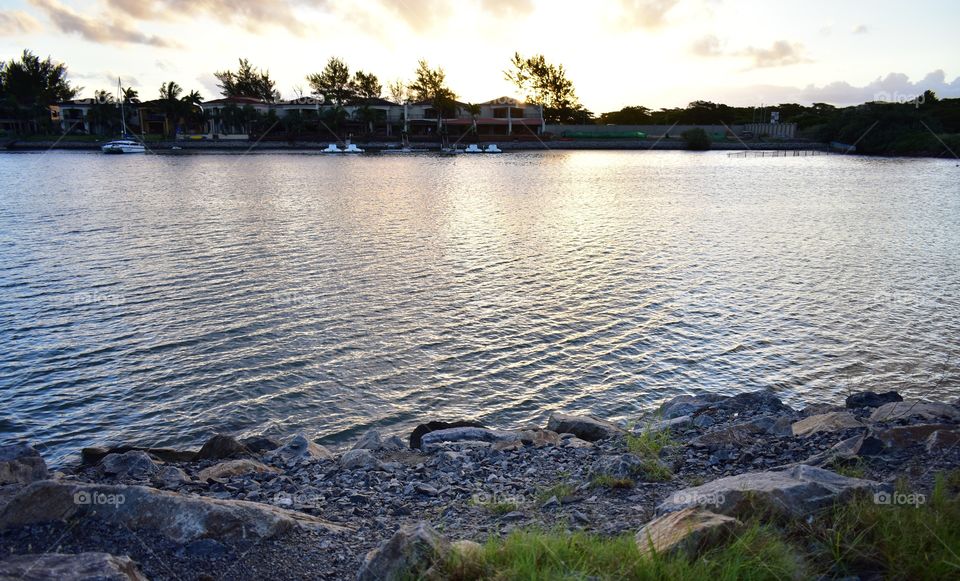 The Waterfront And The Sunset Sky.