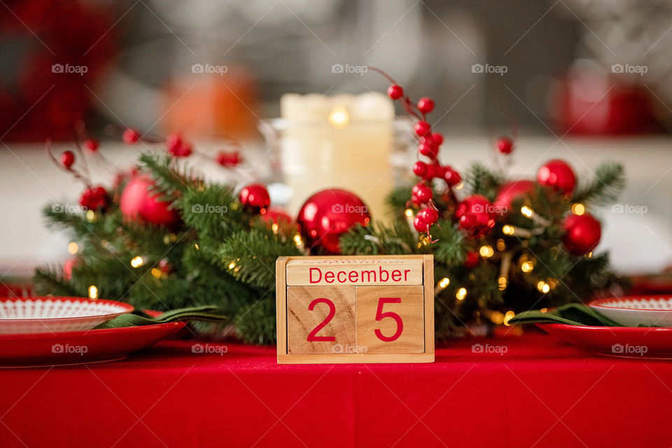 Christmas background with wooden block calendar with the date of December 25