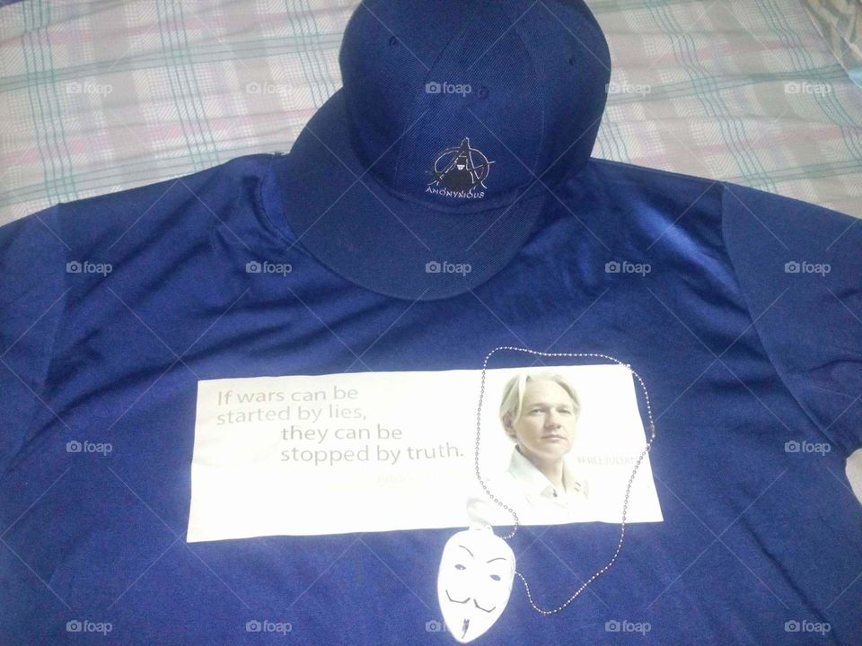 my collection of anonymous hat,necklace and a Julian Assange- t shirt. thank you for giving me this.. well appreciated you know who you are..