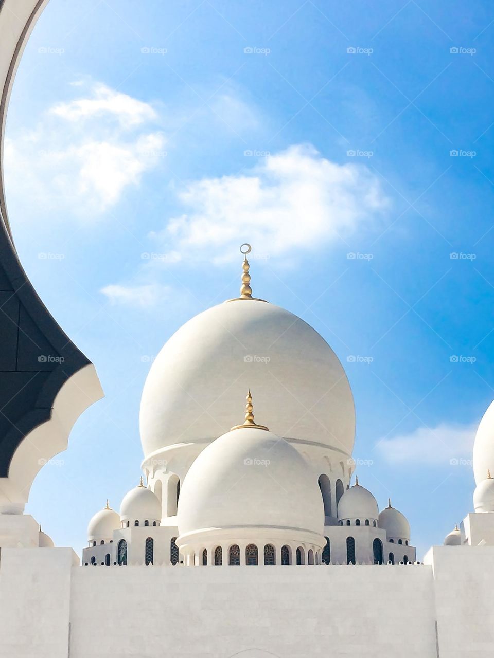 Sheikh zayed mosque modern architecture abu dhabi. White stone, the dome of the mosque on the blue sky. Beautiful architecture