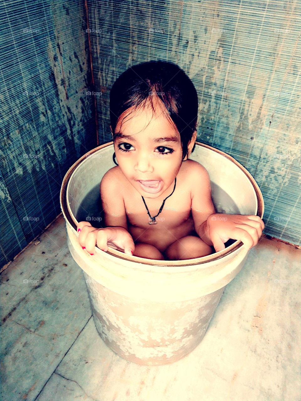 Take A shower By A little Cute Baby In Bukket.