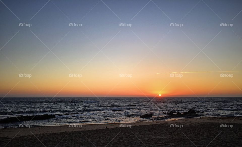 Summer sunset by the beach 