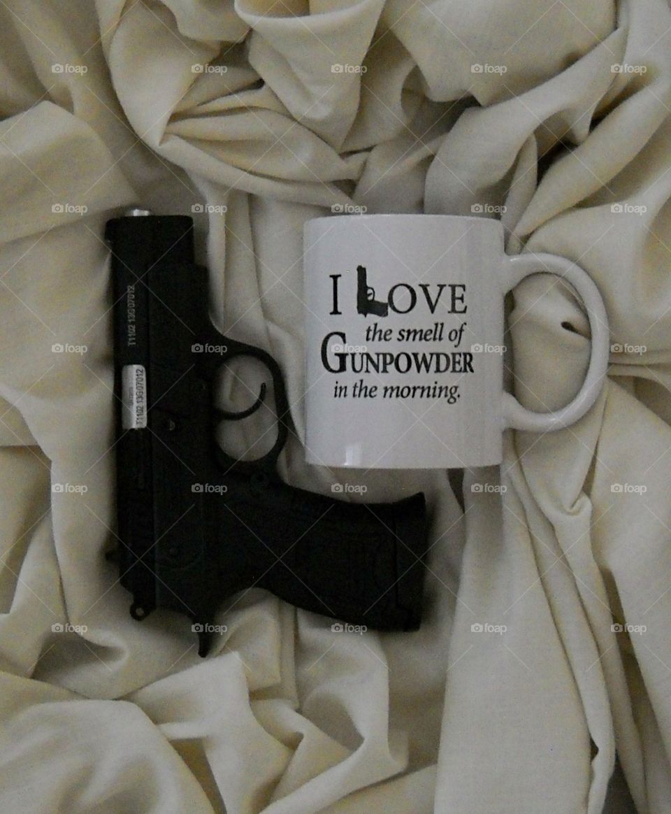 Pistol and Cup