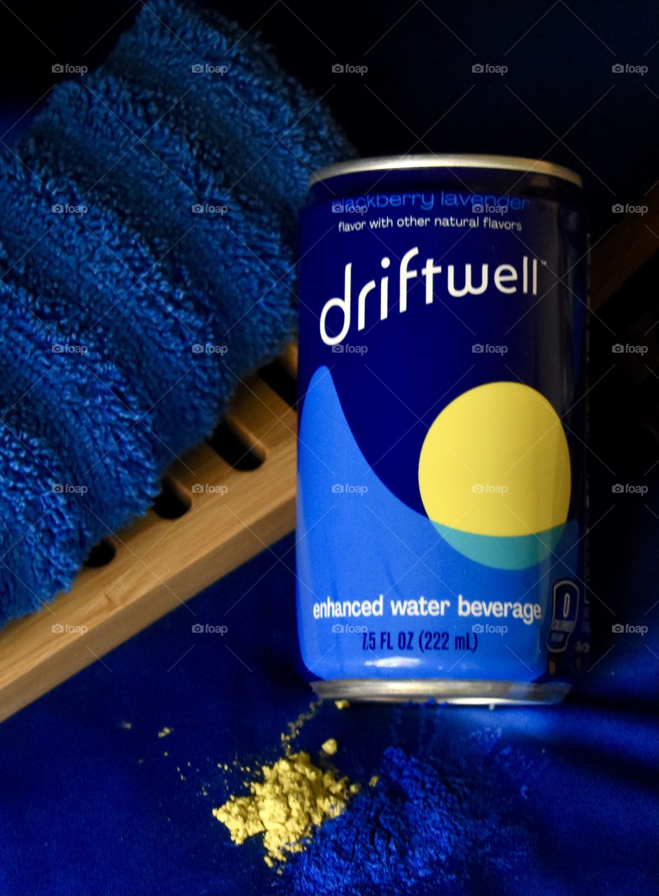 Driftwell still life with blue background and blue cloth and powdered paint