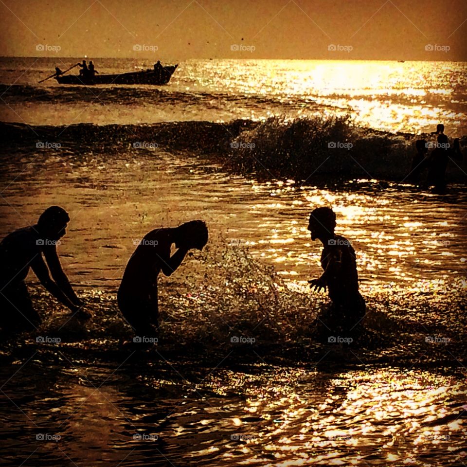 guys playing in beach silhouette 