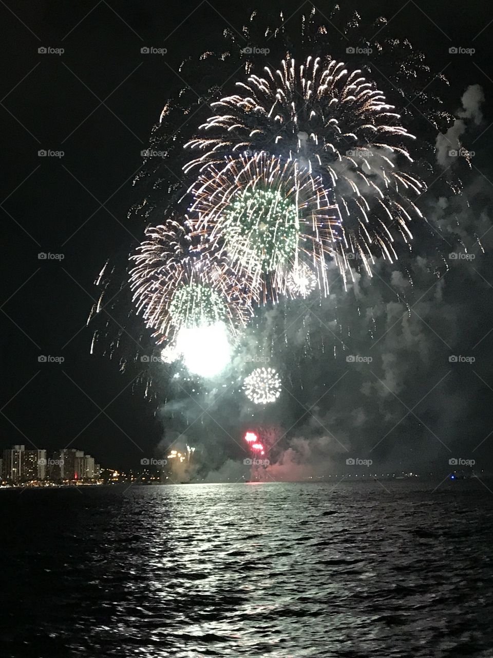 Hawaii Festival Fireworks at Night over the Ocean from out at sea! 