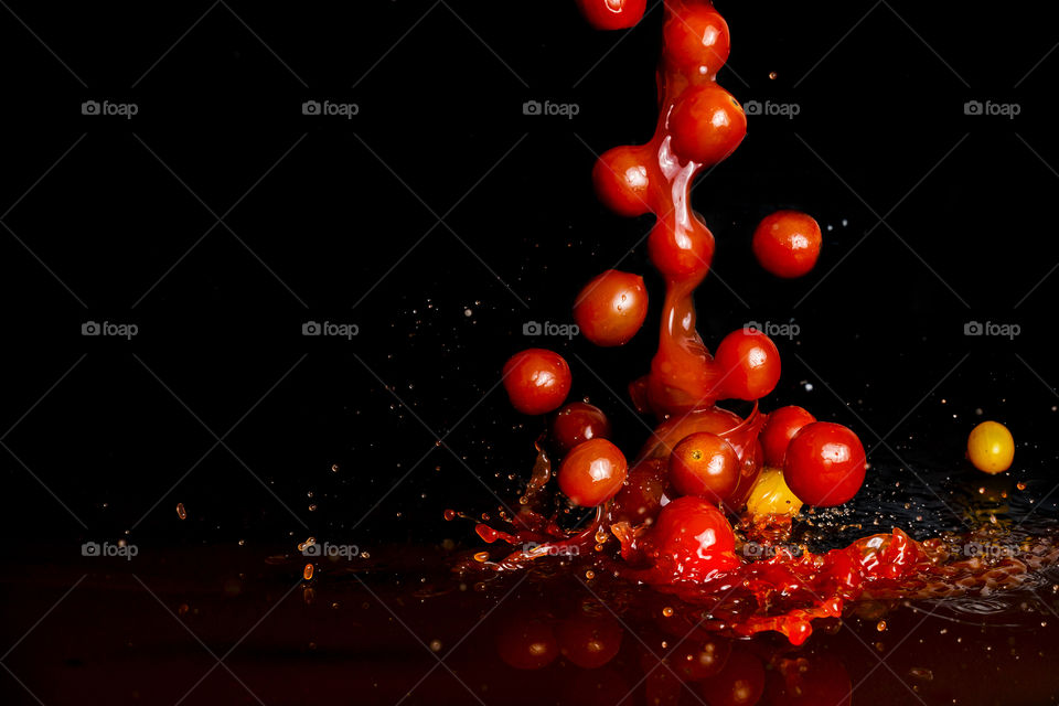 Tomatoes cherry on black