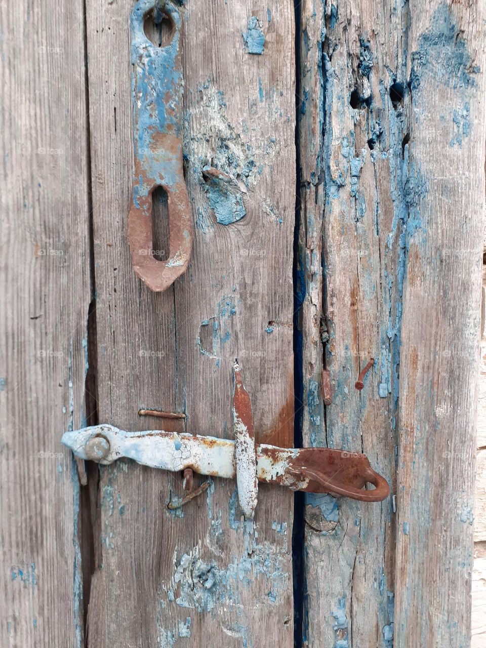 An ancient metal door handle called a doorknob