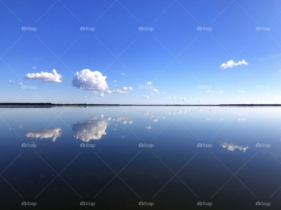 Still mirror like sea lake sky reflection