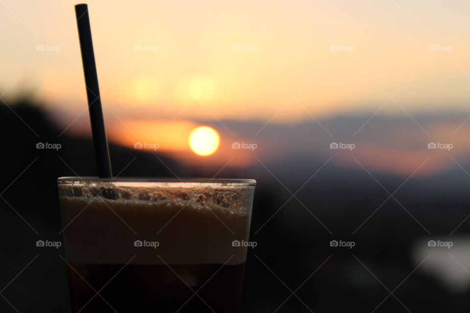 drinking coffee at the sunset
while sun bokeh fades behind my glass