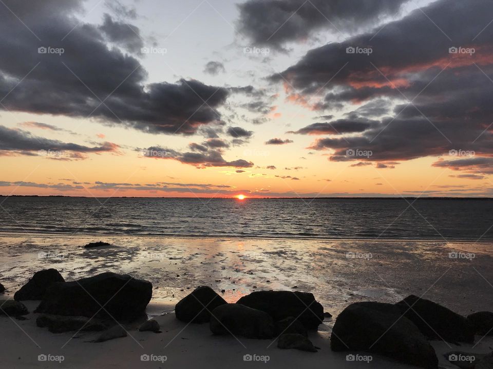 Beach sunset with rocks