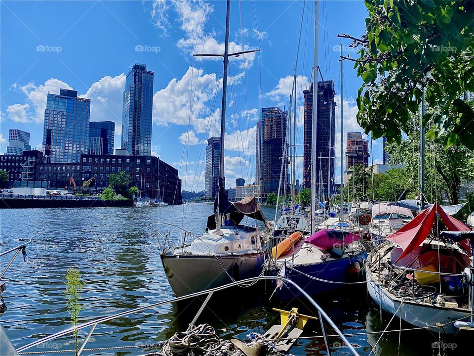 This is “Newtown Creek” by the “Pulaski Bridge” in LIC, Queens. Beyond the high rises of LIC one can see the “Manhattan” skyline here as well as “Greenpoint”, Brooklyn. 2023. Hypnotic Productions