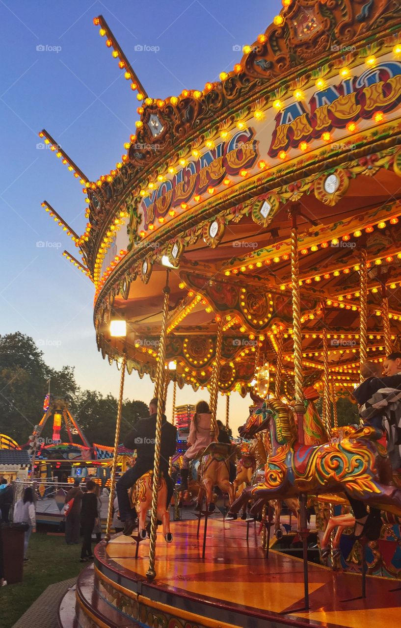 Peoples enjoying on carousel