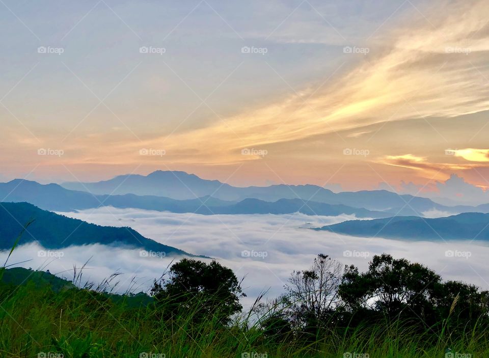 Sunrise above the sea of clouds