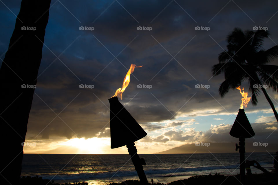 Sunset with torches on Maui Hawaii