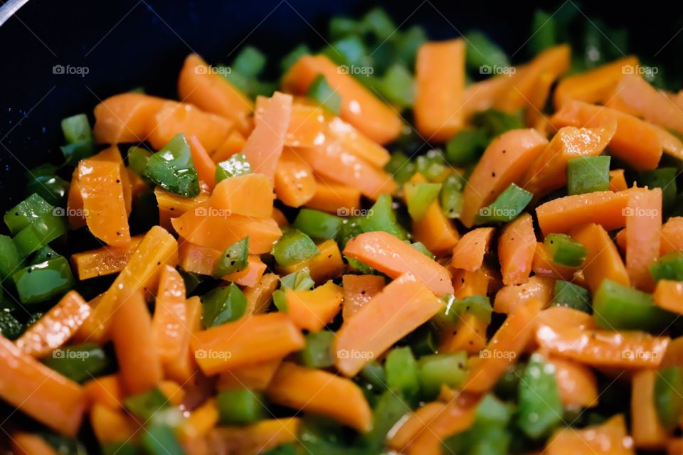 Healthy Homemade Meal, Carrots And Green Peppers In A Frying Pan 