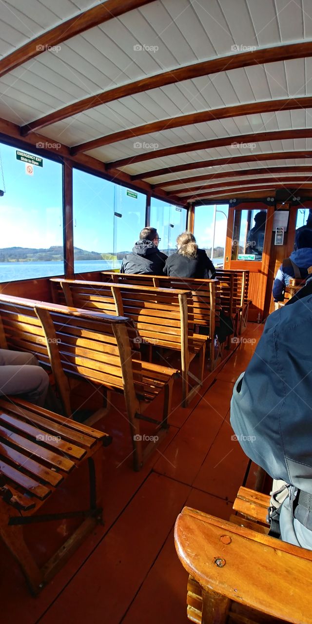 on board small boat looking at people inside