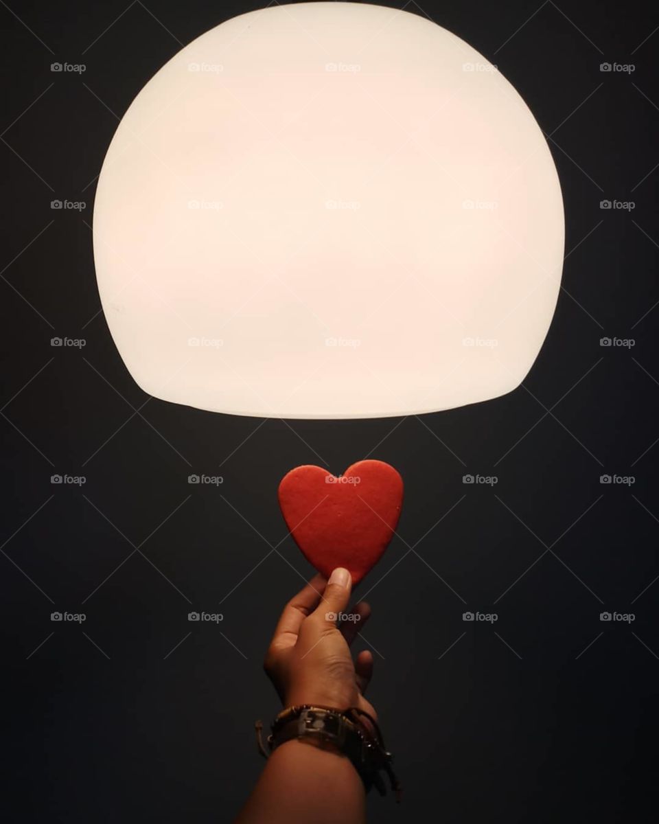 Heart shaped cooky under bowl lamp.