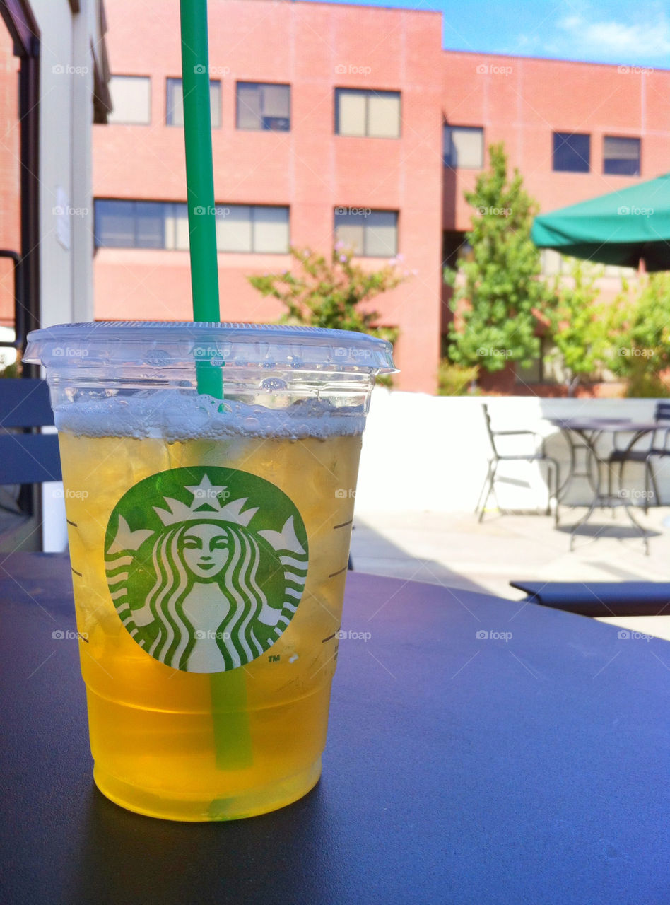 Starbucks venti sized tea on patio 