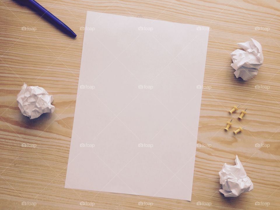 High angle view of blank paper with crumbled paper