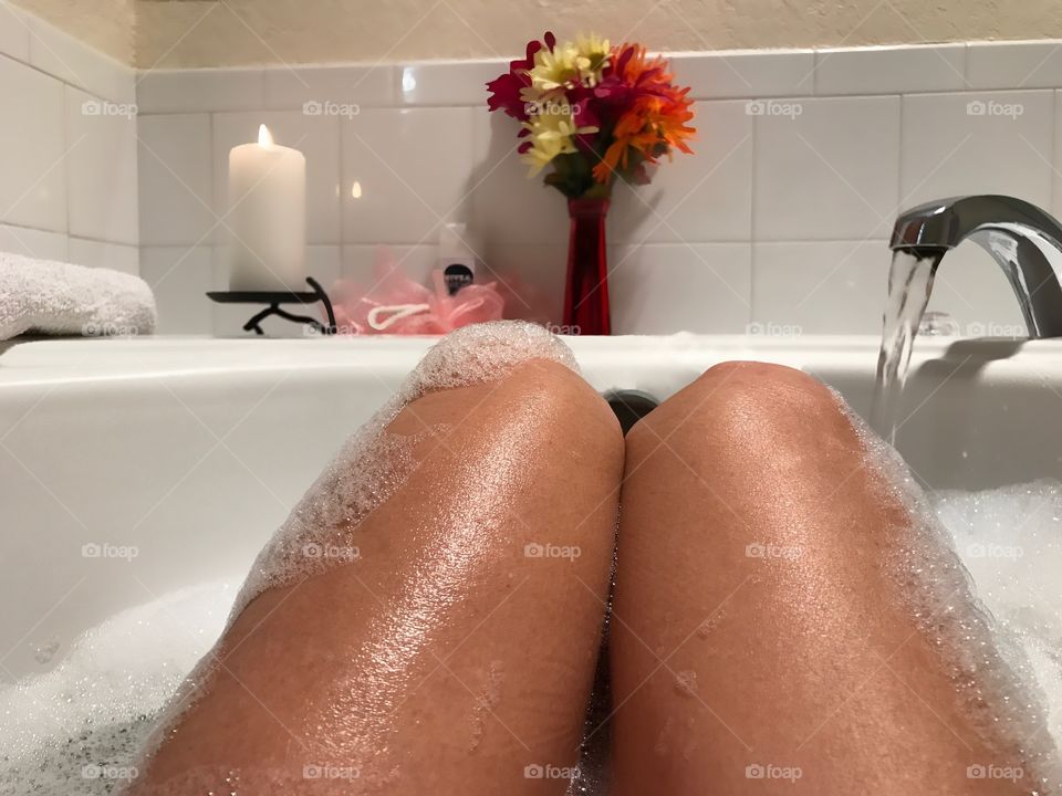 Enjoying a daily ritual-relaxing in a luxurious bubble bath.