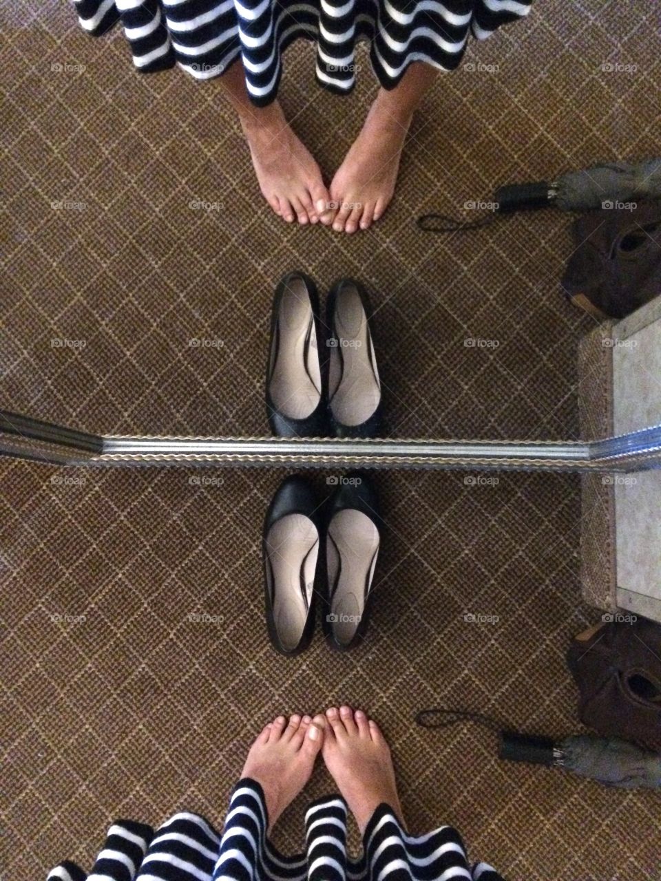 Dress shoe selfie. Black heels. Prepared for rain. Hotel room reflection.