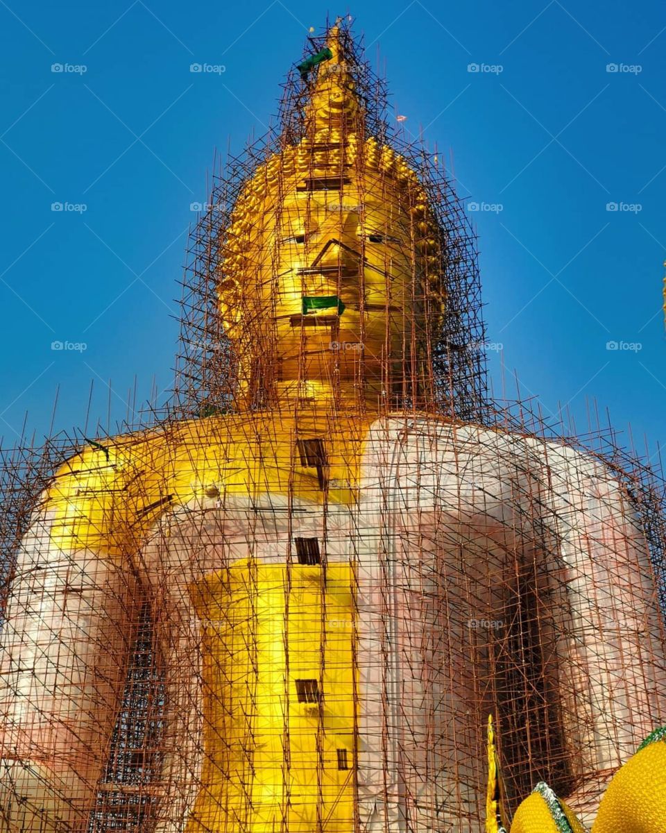 The Giant Buddha at Wat Muang Ang Thong in Ang Thong, Thailand. It was under renovation on my last visit, which gave it quite an interesting appearance.