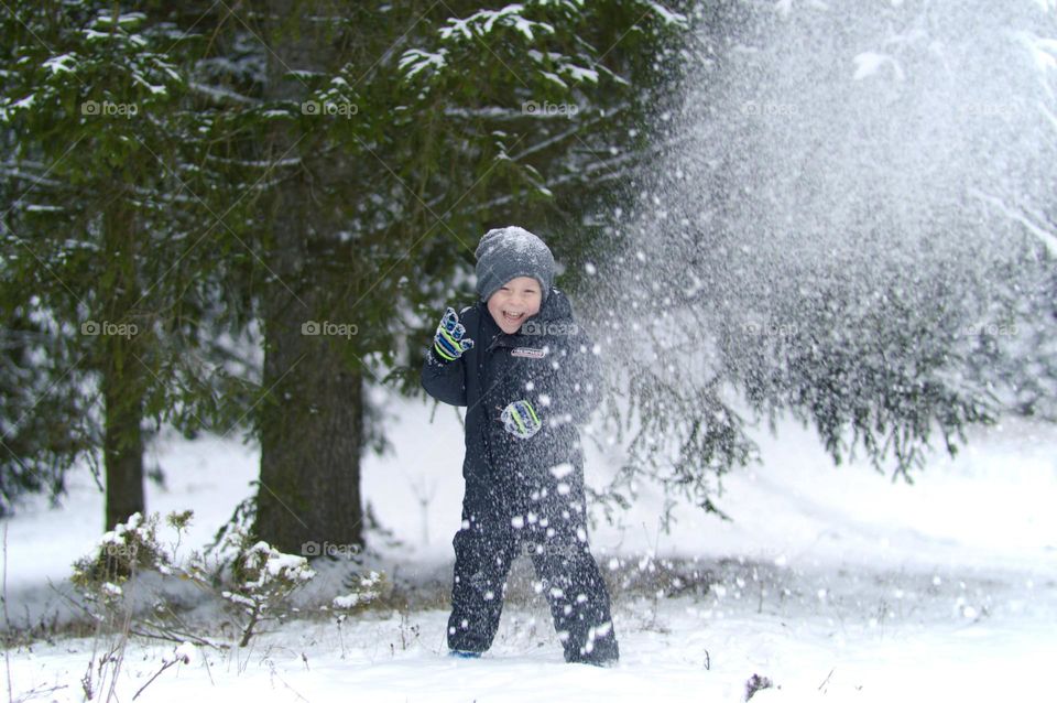 boy having fun in snow