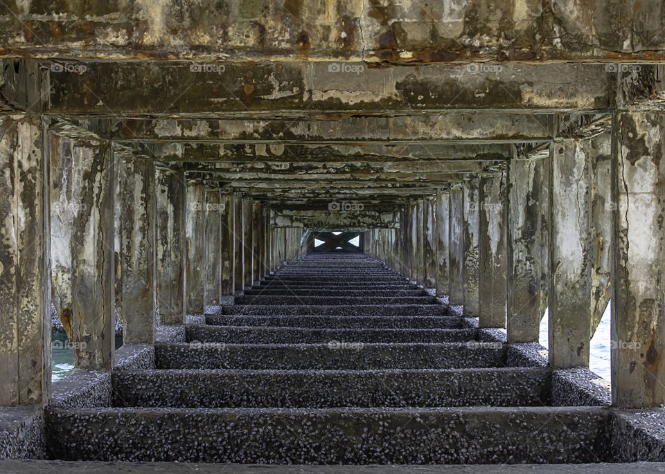 Structural concrete columns and beams under the bridge was damaged at sea.