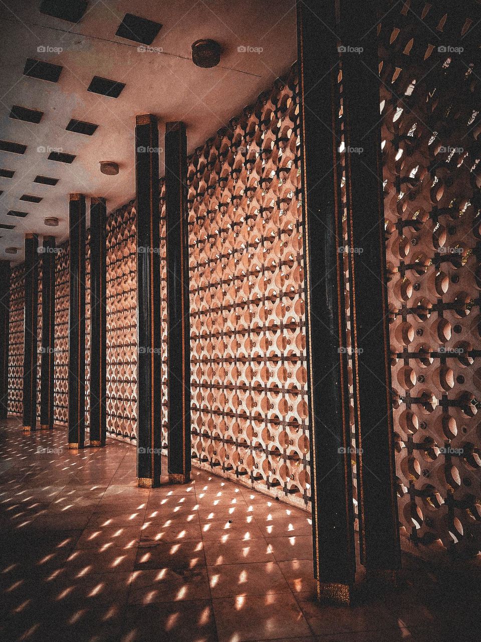 Old buildings pathway with shadows on the floor