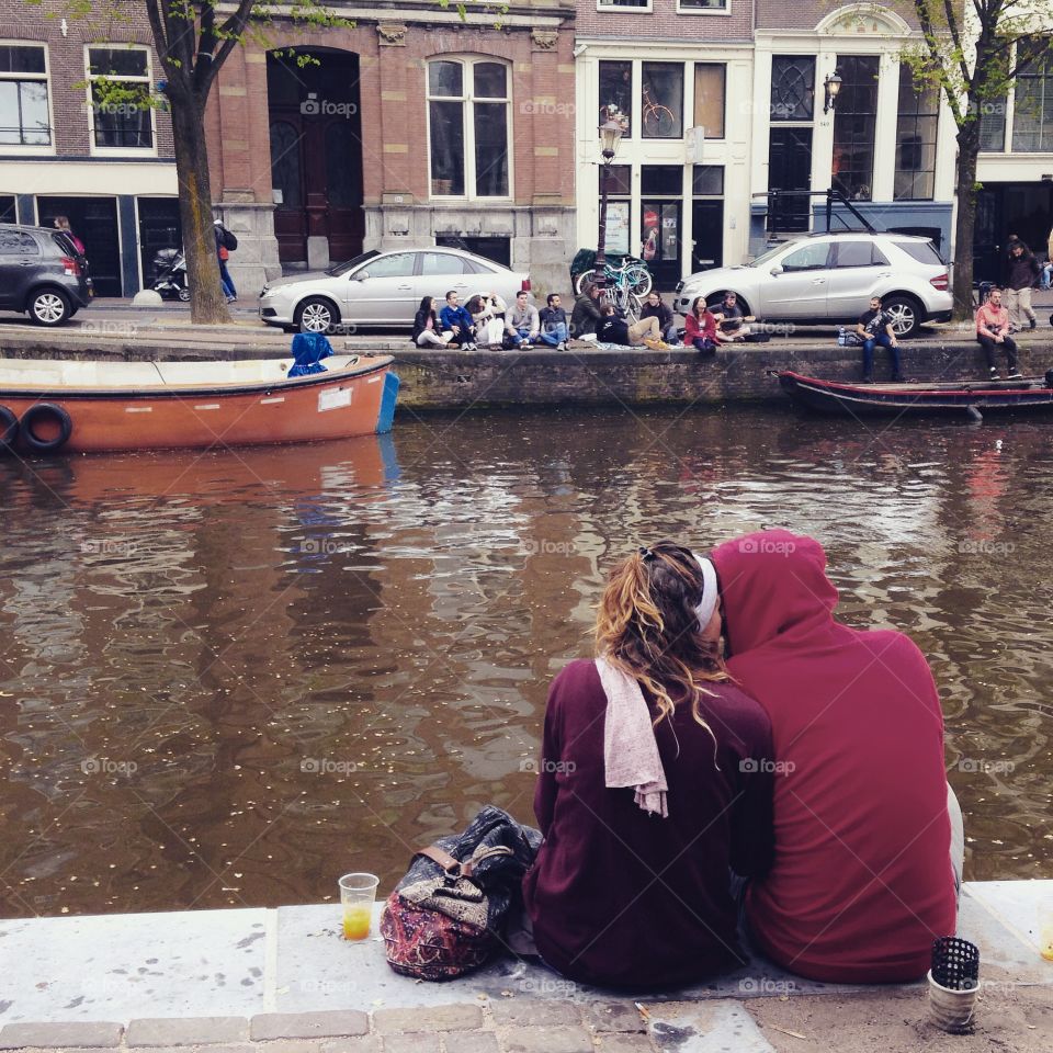 Happy Couple kissing at canal