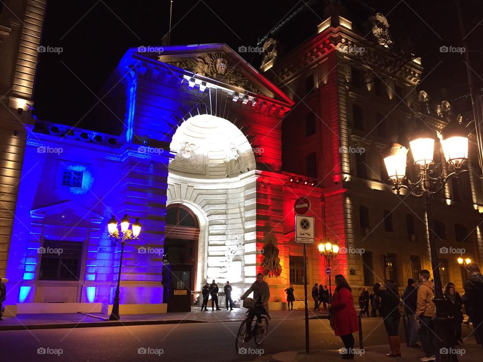 Church in Paris illuminated with the colors of the French flag