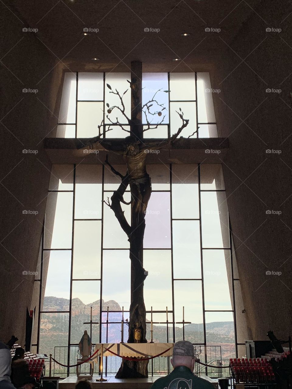 Chapel of the Holy Cross in Sedona Arizona. The cross shines through on a cloudy day.