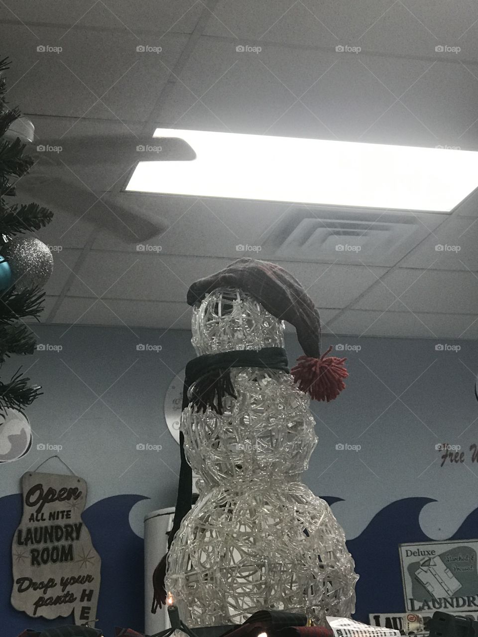 White snowman with a hat & scarf 