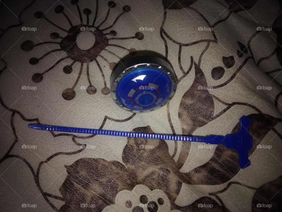 Spinning top ، light blue ، flower