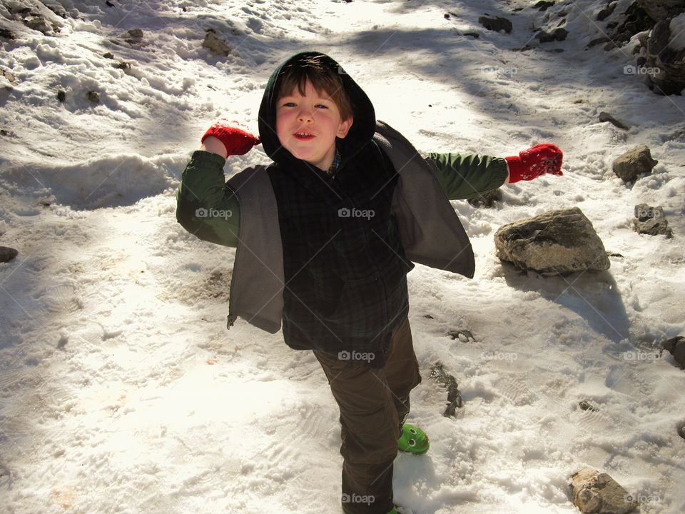 Boy Throwing Snowballs
