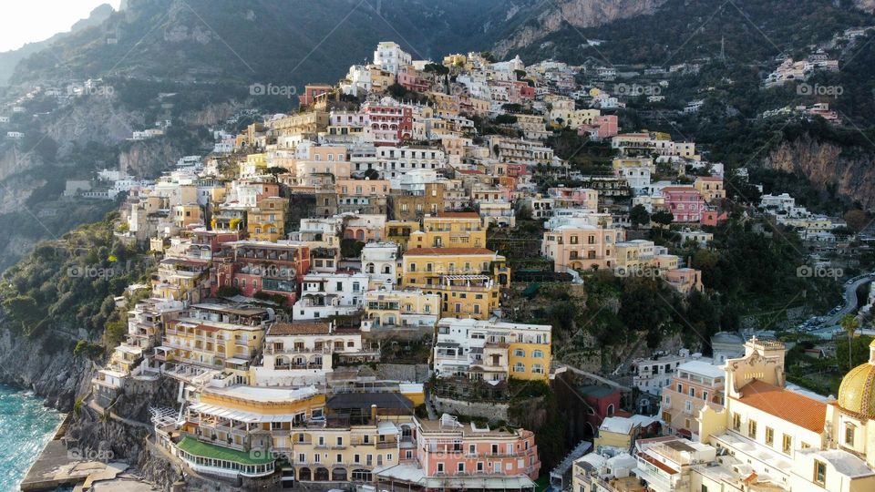 Positano Top view of sea, Positano town and mountains. Turquoise colors, Green, blue sky and Beautiful view at Sunset